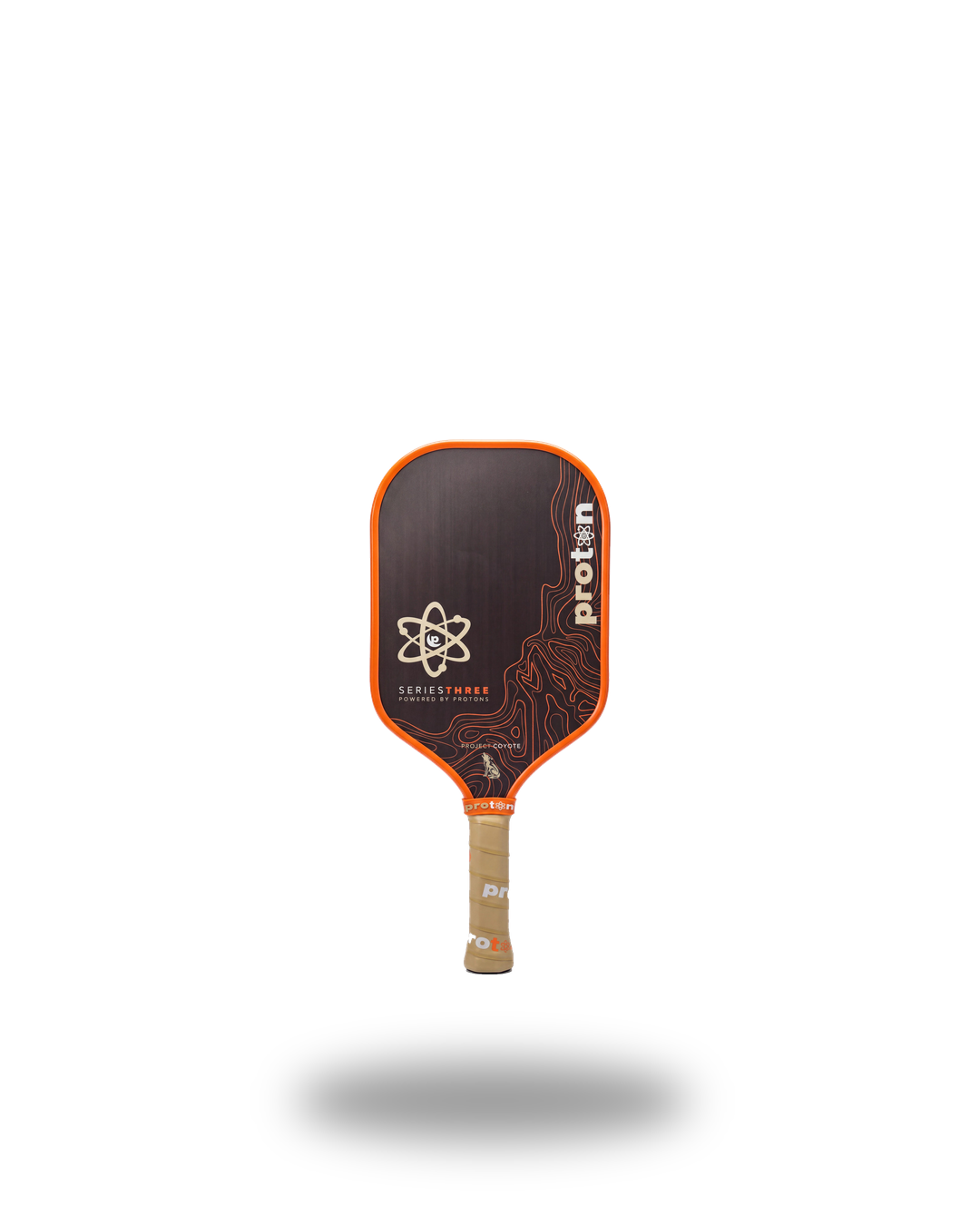 Proton Project Coyote Elongated 15mm pickleball paddle — front face, orange edge guard and tan grip